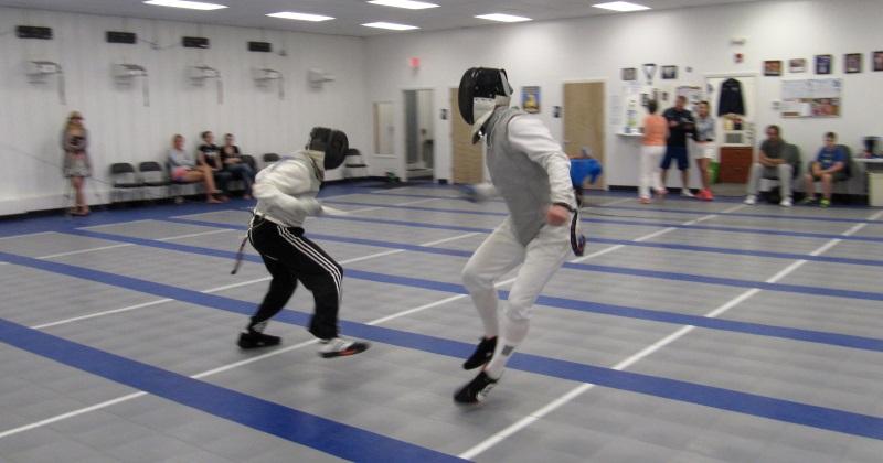 Experienced adult fencers bouting during FAB Open Fencing in Watertown