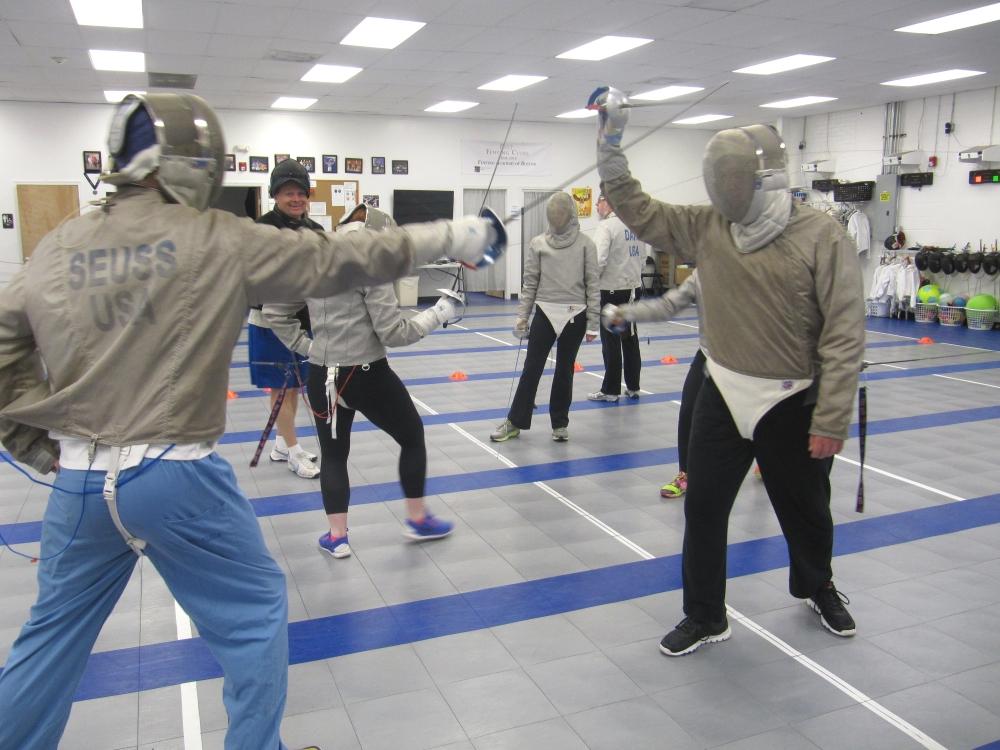 Adult fencers practicing together at Fencing Academy of Boston in Watertown
