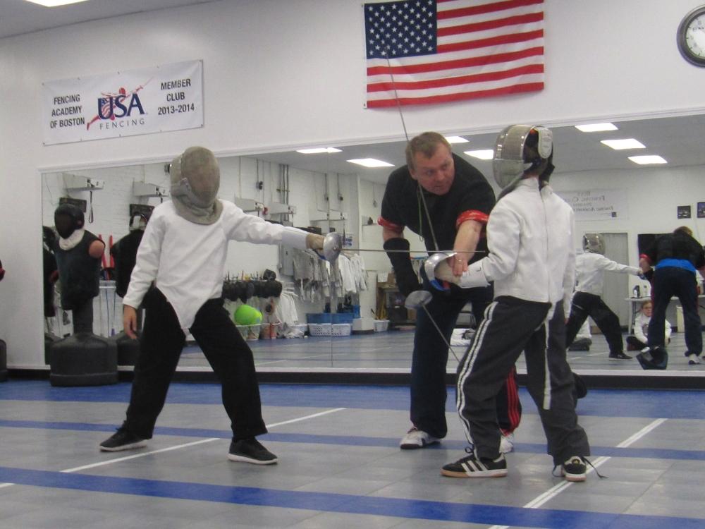Youth fencers practicing saber at Fencing Academy of Boston in Watertown